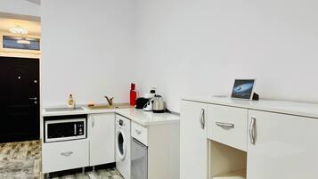 Fridge, coffee/tea maker, cookware/dishes/utensils