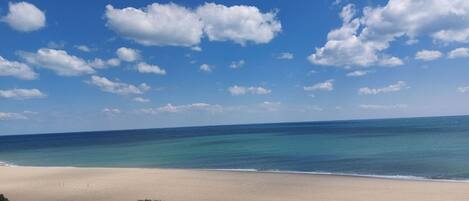 A beach with clear skies and calm waters.