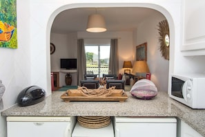 Microwave, dishwasher, coffee/tea maker, cookware/dishes/utensils