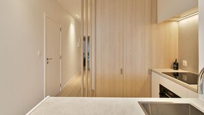 A modern bathroom with a large mirror, a sink, and a toilet. - Flat in Blankenberge Near Belgium Pier (Blankenberge)