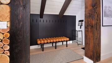 Cozy seating area with a bench, rug, and unique decor.