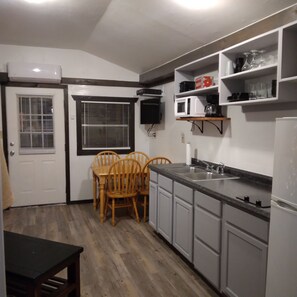 Fridge, microwave, stovetop, coffee/tea maker