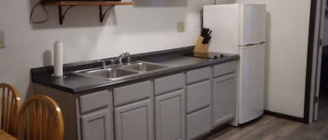 Fridge, microwave, stovetop, coffee/tea maker