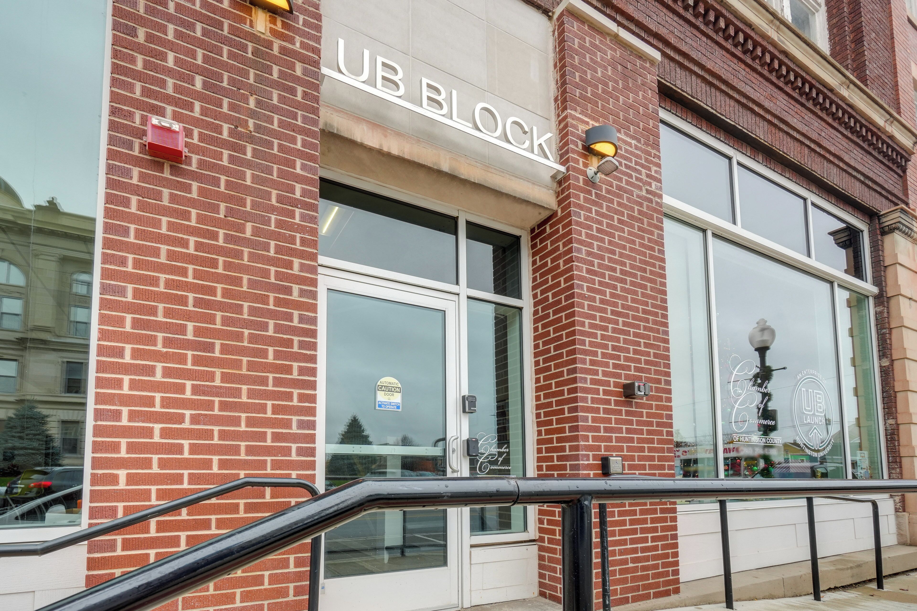 A brick building with a storefront labeled "UB BLOCK".