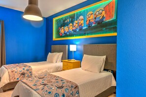A hotel room with two beds, a large mural of minions, a lamp, and a ceiling light. - Amazing 5BD Family Townhouse at Paradiso Grande (Orlando)