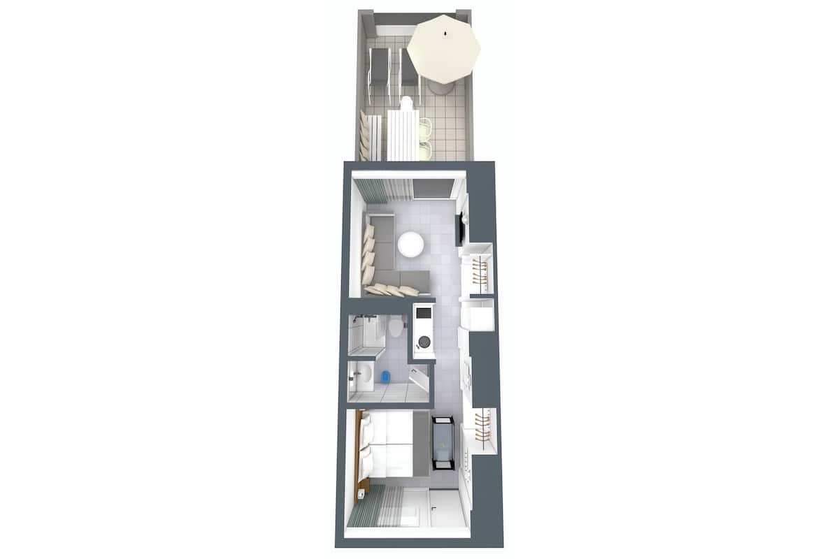 Vue d’ensemble d’un appartement moderne, avec cuisine, coin repas et salon.