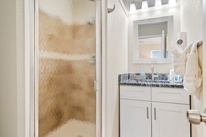 Shower, hair dryer, towels, shampoo
