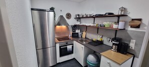 Fridge, microwave, stovetop, coffee/tea maker