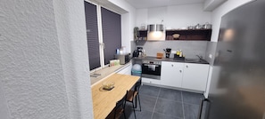 Fridge, microwave, stovetop, coffee/tea maker
