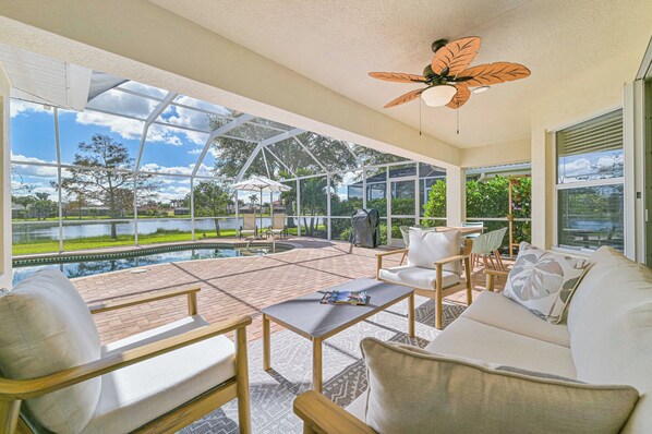 Lake Vista - Enjoy the stunning lake view from the screened in pool area with heated pool