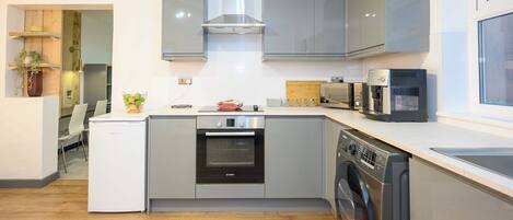 Coffee/tea maker, fridge, microwave, oven