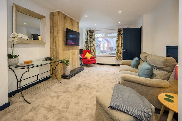 Open plan living area which contains comfortable sofa where you can relax watching the widescreen smart TV.