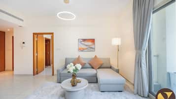 Luxury Apartment | Living area | 65-inch LED TV with cable channels