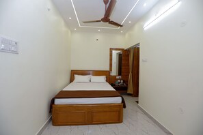 Basic Double Room | Living area | 32-inch Smart TV with digital channels - Temple View Residency (Thiruvallur)