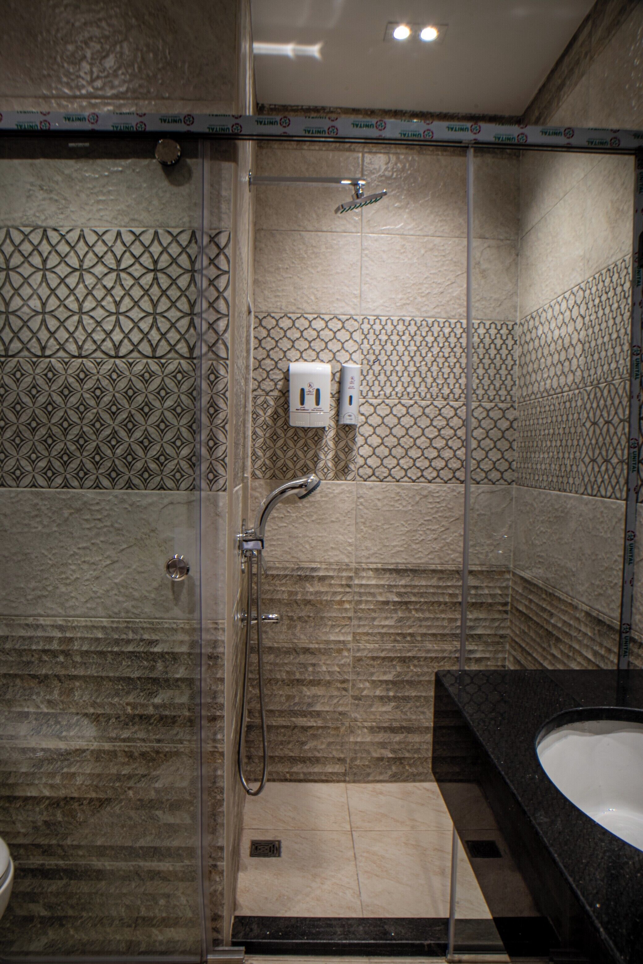 Shower, hair dryer, slippers, towels