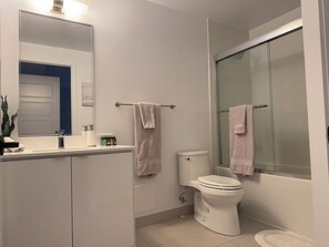 Shower, hair dryer, towels, soap