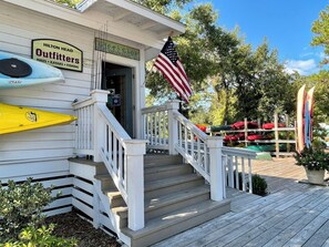 Enjoy scenic views from the outdoor space, featuring a deck and kayaks and canoes.