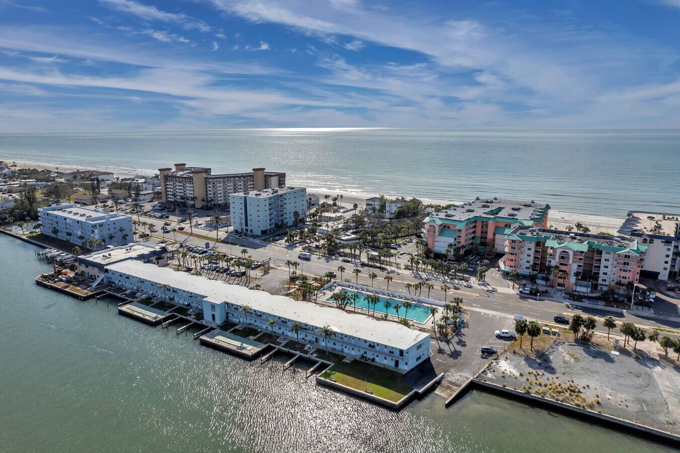 Aerial view of the waterfront complex and marina, capturing the lively coastal setting.