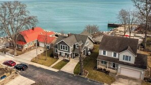 A residential area with houses, a dock, and a body of water.