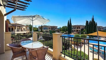 Apartment, 2 Bedrooms, Balcony, Pool View | Outdoor dining