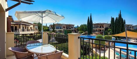 Apartment, 2 Bedrooms, Balcony, Pool View | Outdoor dining