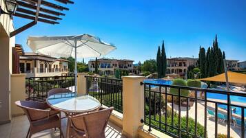 Apartment, 2 Bedrooms, Balcony, Pool View | Outdoor dining