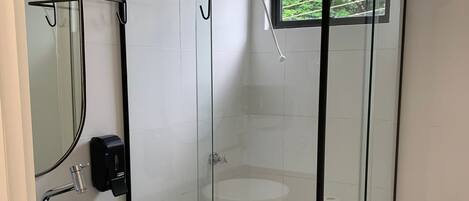 Shower, hair dryer, towels, toilet paper