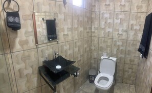 Shower, towels, soap, toilet paper