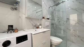 Shower, hair dryer, towels, soap