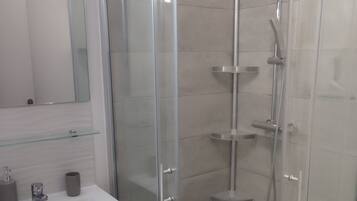 Shower, eco-friendly toiletries, hair dryer, towels