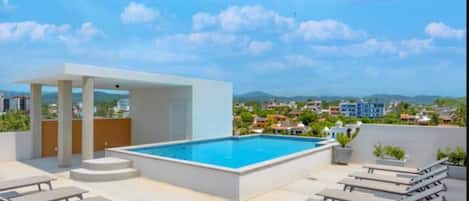Outdoor pool, open 9:00 AM to 10:00 PM, sun loungers