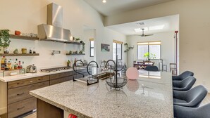 A modern kitchen with granite countertops, built-in appliances, and a central island. - Mtn Views, Pool & Hot Tub: Phoenix Oasis (Phoenix)