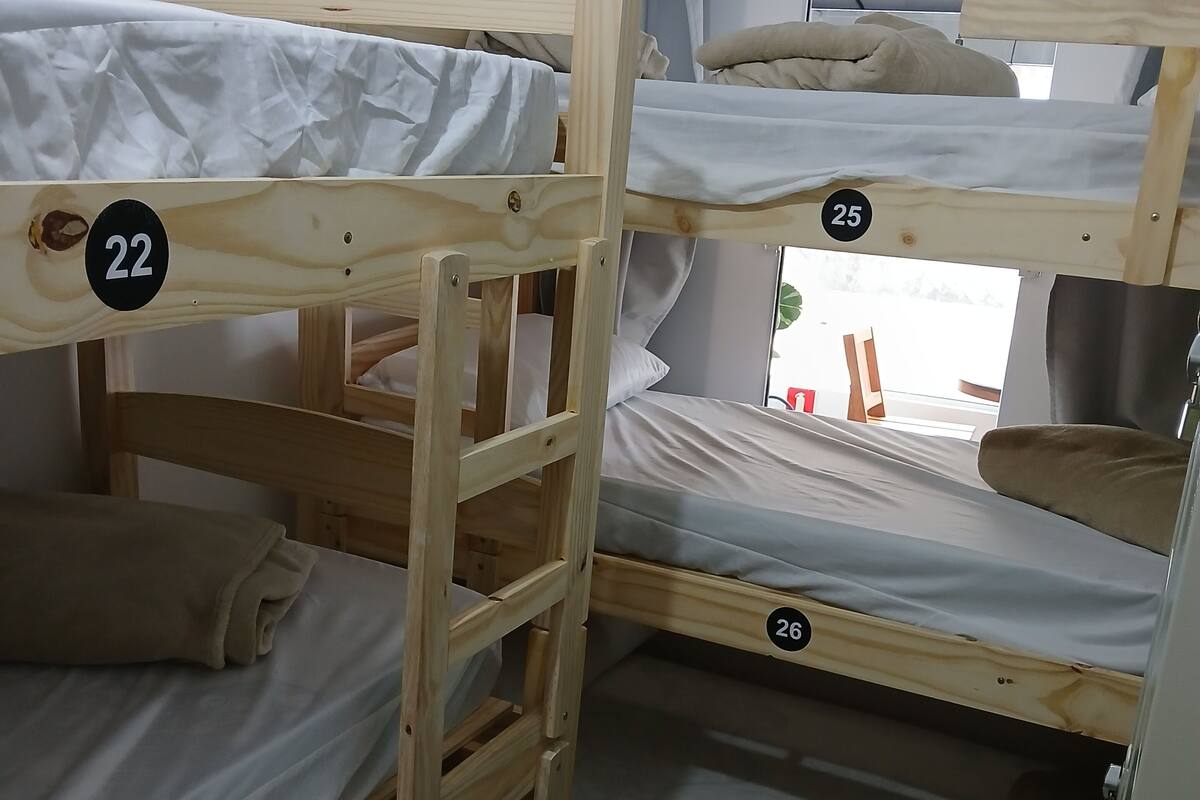 A bunk bed room with three levels, each marked with a number.