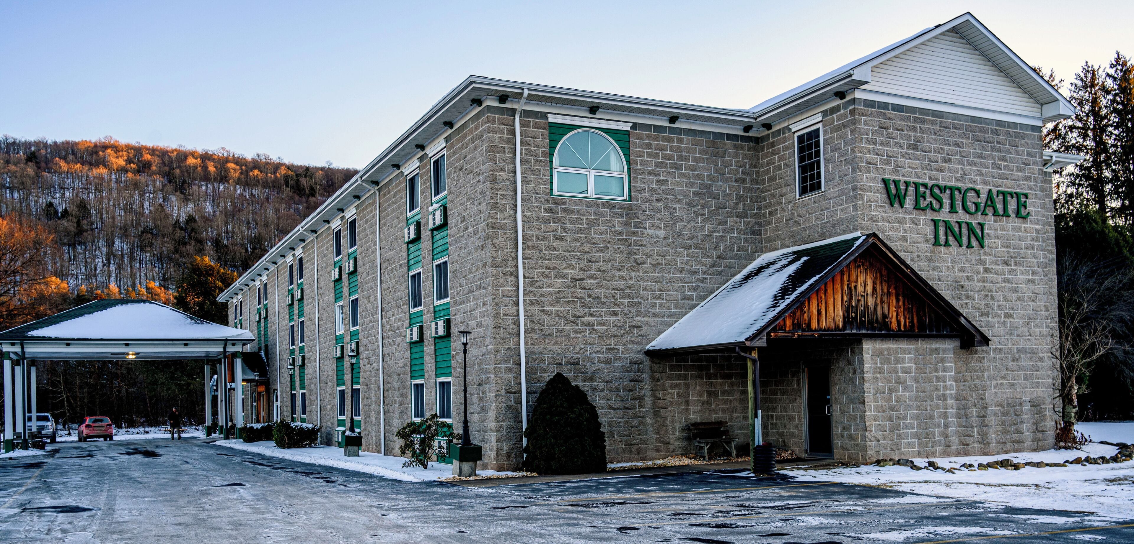 A Westgate Inn hotel with a stone facade, multiple windows, and a covered entrance.