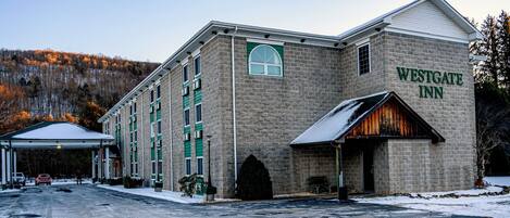 A Westgate Inn hotel with a stone facade, multiple windows, and a covered entrance.