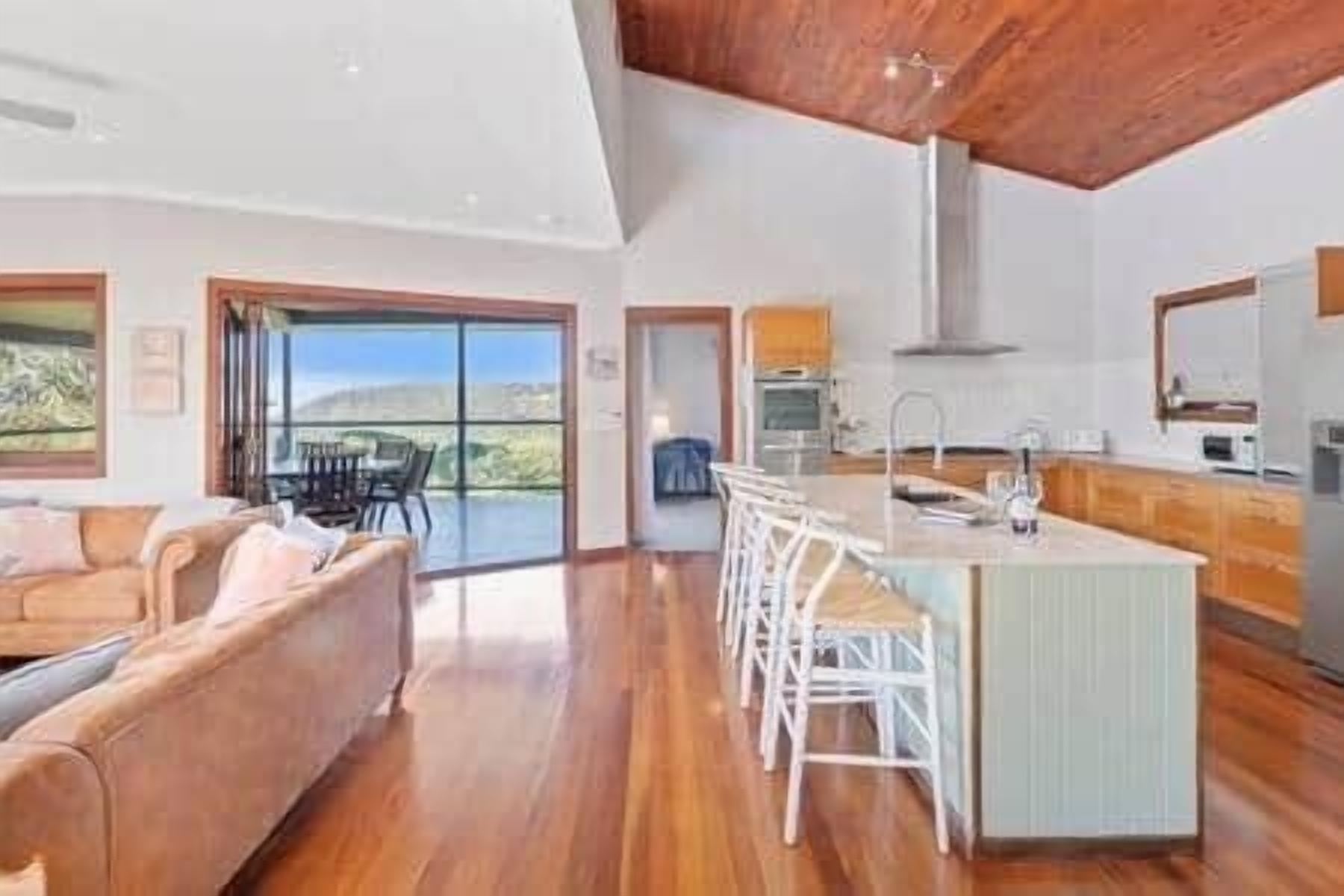 Large open space living area with direct access to two outdoor areas and the Master bedroom.