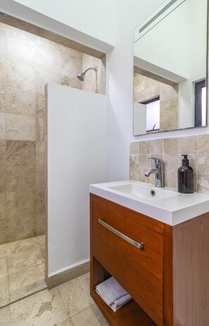Shower, hair dryer, towels, shampoo
