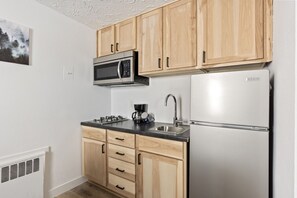 Fridge, microwave, stovetop, coffee/tea maker
