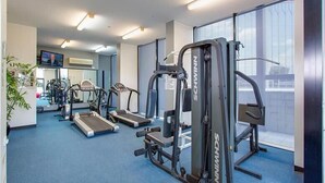 A gym with treadmills, elliptical machines, and weight equipment. - Republic Apartment (Spring Hill)
