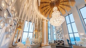 A luxurious interior with a grand chandelier, large windows, and elegant decor. - Arte Cheras by Minsu  (Kuala Lumpur)
