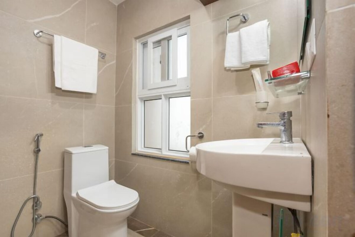 Shower, bathrobes, slippers, towels