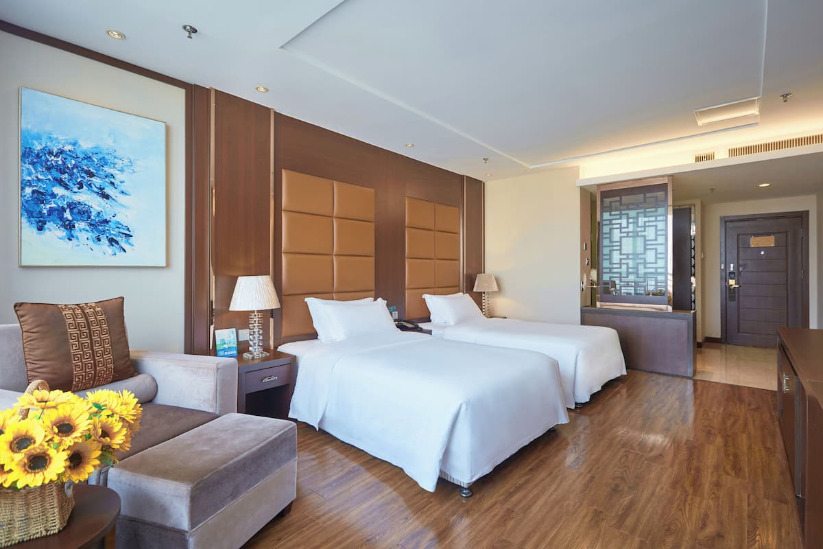 Standaard Twin kamer | 2 slaapkamers, donzen dekbedden, een minibar met enkele gratis items
