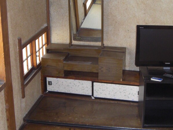 A staircase with wooden steps and a small wooden platform at the bottom.