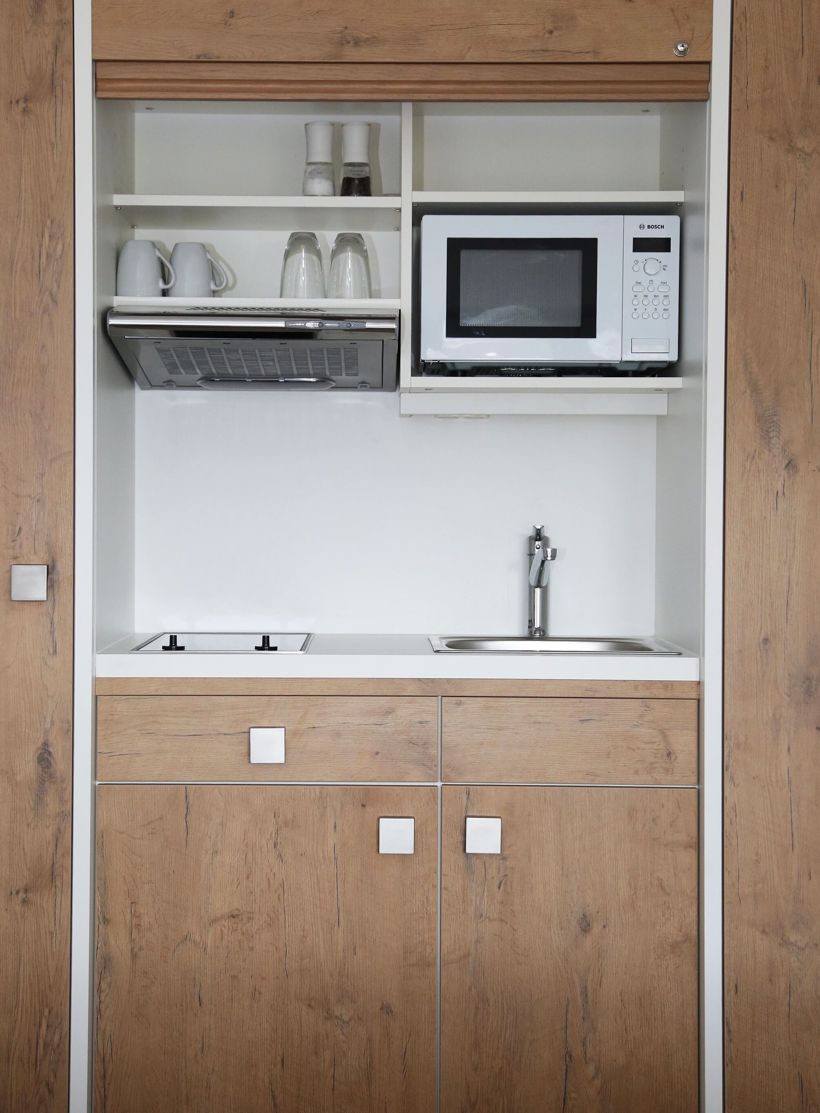 Fridge, microwave, stovetop, coffee/tea maker