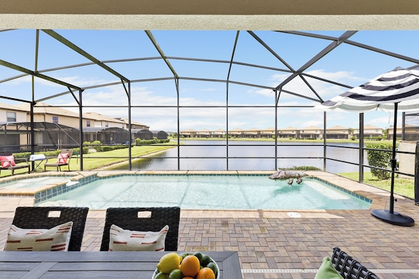 Screened pool and al fresco dining.