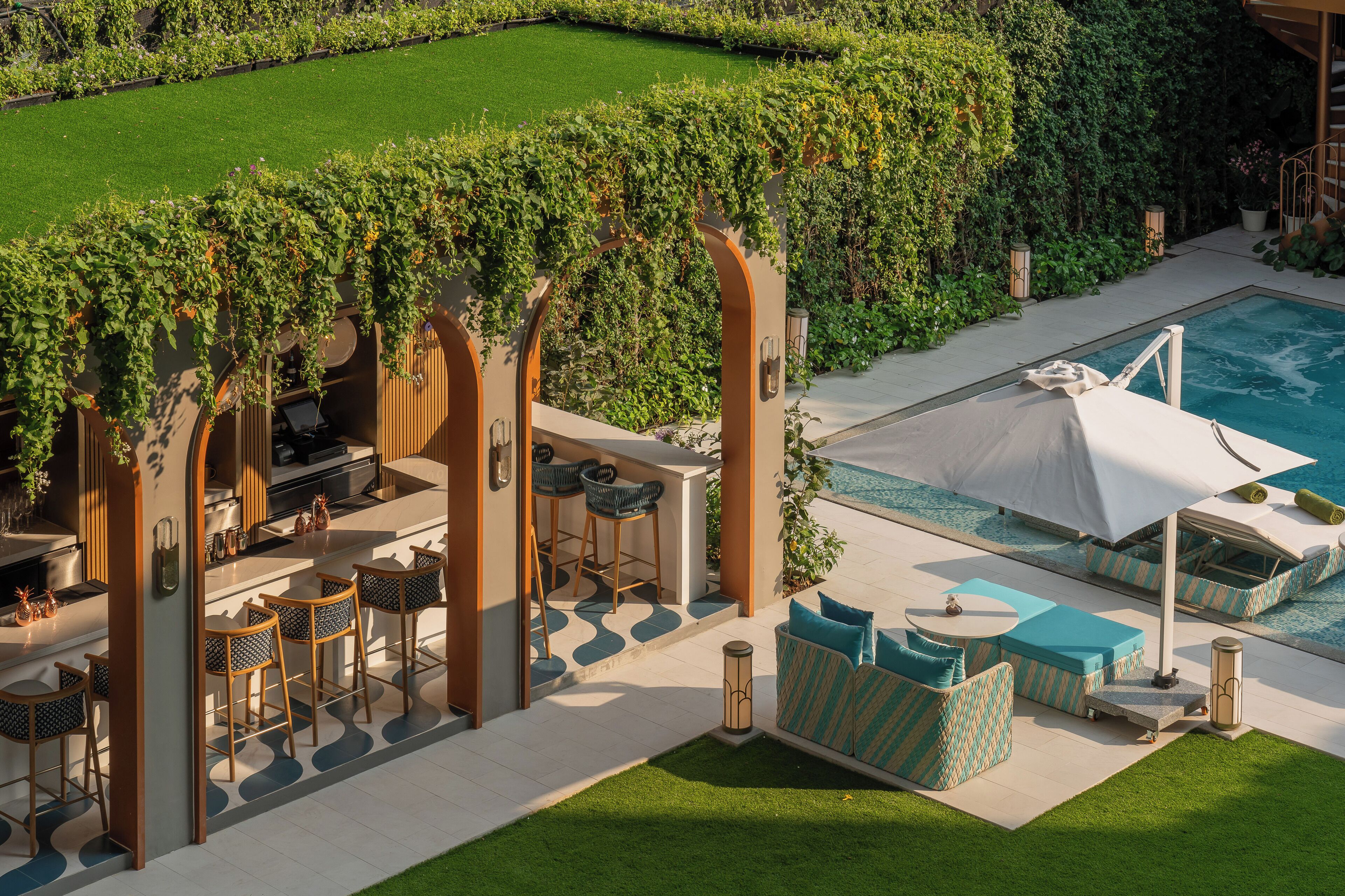 Outdoor pool, open 7:00 AM to 7:00 PM, pool umbrellas, pool loungers