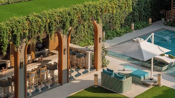 Outdoor pool, open 7:00 AM to 7:00 PM, pool umbrellas, pool loungers