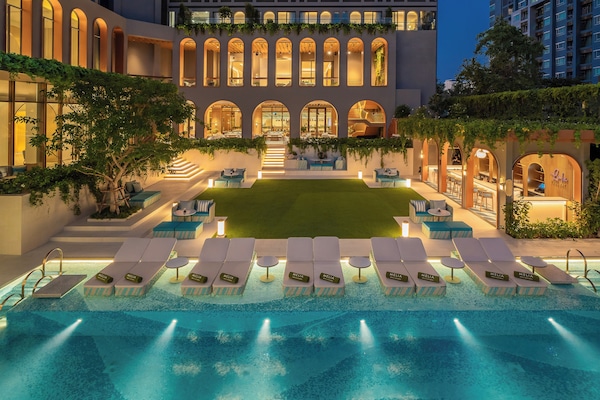 Outdoor pool, open 7:00 AM to 7:00 PM, pool umbrellas, sun loungers