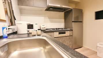 Fridge, microwave, electric kettle, dining tables