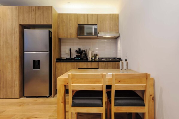 Fridge, microwave, stovetop, cookware/dishes/utensils